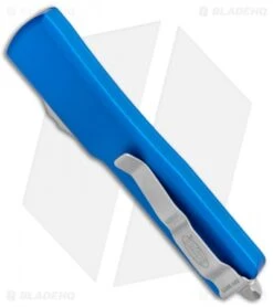 Microtech UTX-70 D/A OTF D/E Automatic Knife Blue (2.4" Stonewash Serr) 6 Microtech UTX-70 D/A OTF D/E Automatic Knife Blue (2.4" Stonewash Serr) -Microtech Microtech UTX 70 DA OTF DE Auto Blue SW Serr 147 11BL BHQ 98266 jr side