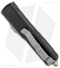 Microtech UTX-85 D/E OTF Automatic Knife Black (3.125" Stonewash Full Serr) 6 Microtech UTX-85 D/E OTF Automatic Knife Black (3.125" Stonewash Full Serr) -Microtech Microtech UTX 85 DE OTF Auto Black SW Full Serr 232 12 BHQ 100772 jr side